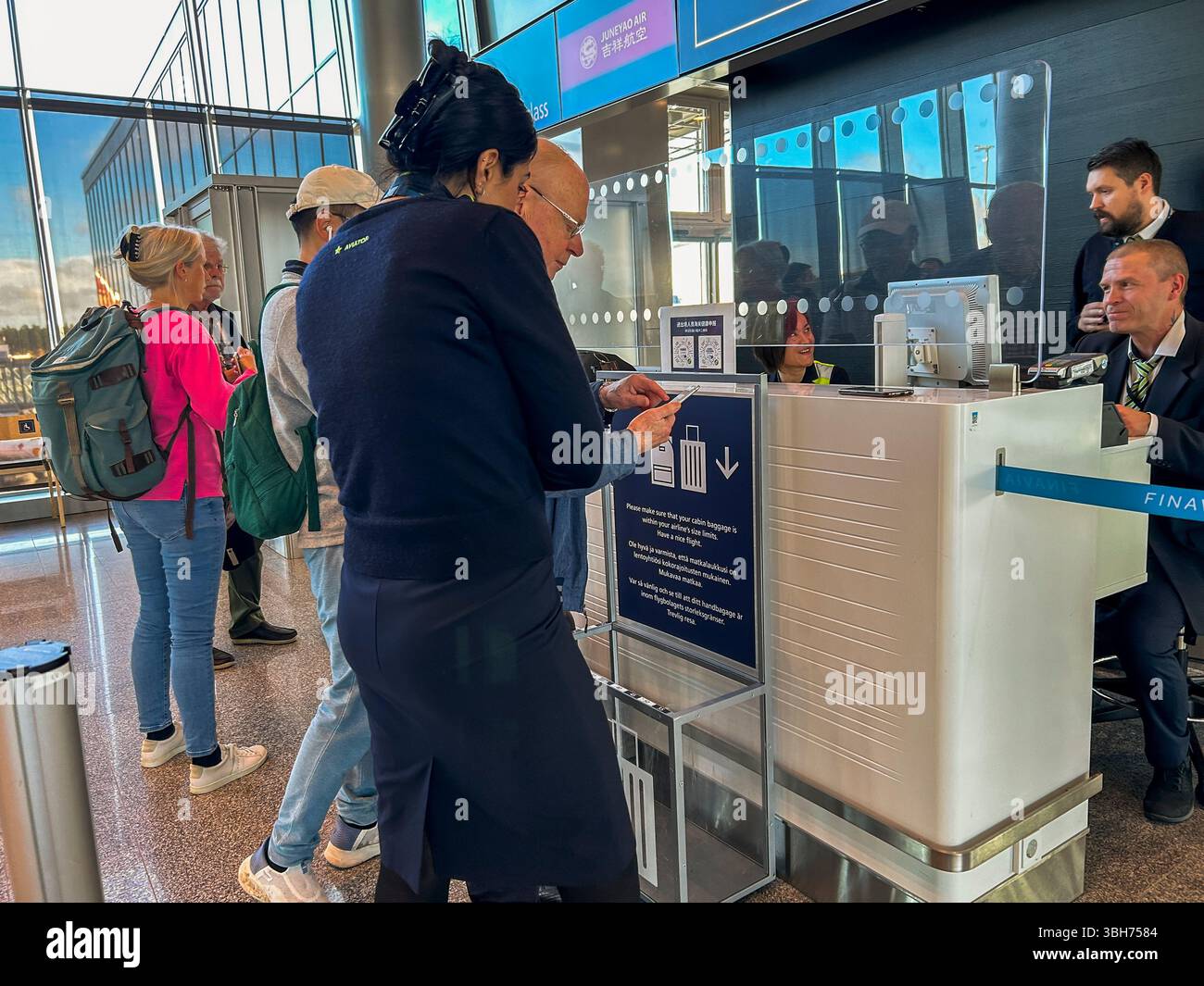 Vantaa, Finland, Views inside, Group People, Tourists Traveling, International Airport Verifying Travel Documents for Travel to China, Security Desk Stock Photo