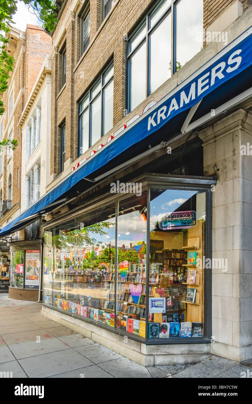 Washington D.C., USA, - May 23, 2025 - A street-level Kramers bookstore window decorated with colorful rainbow hearts and flags, with books neatly arr Stock Photo