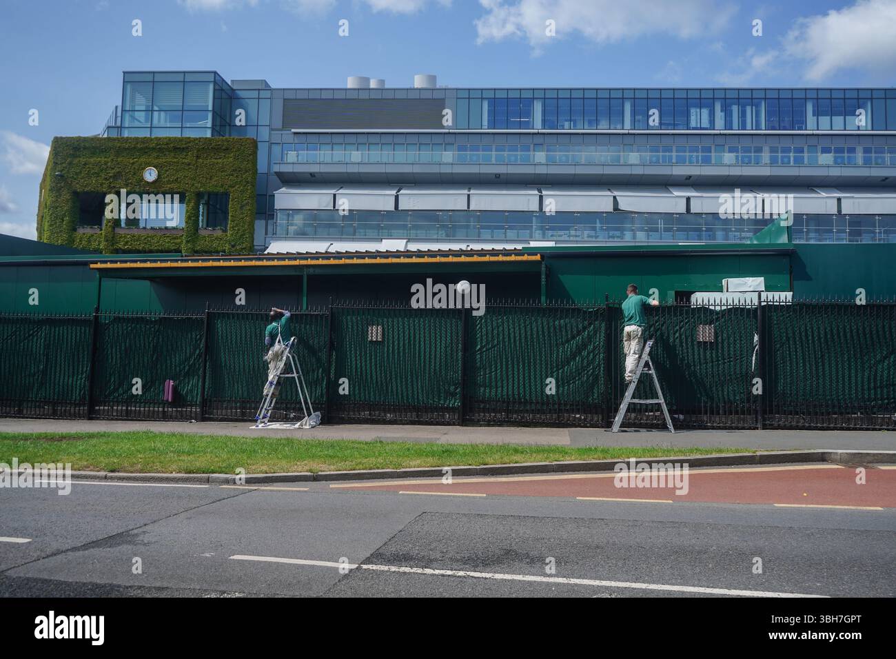 Wimbledon London, UK. 8 June 2025 Staff paint the metal perimeter ...