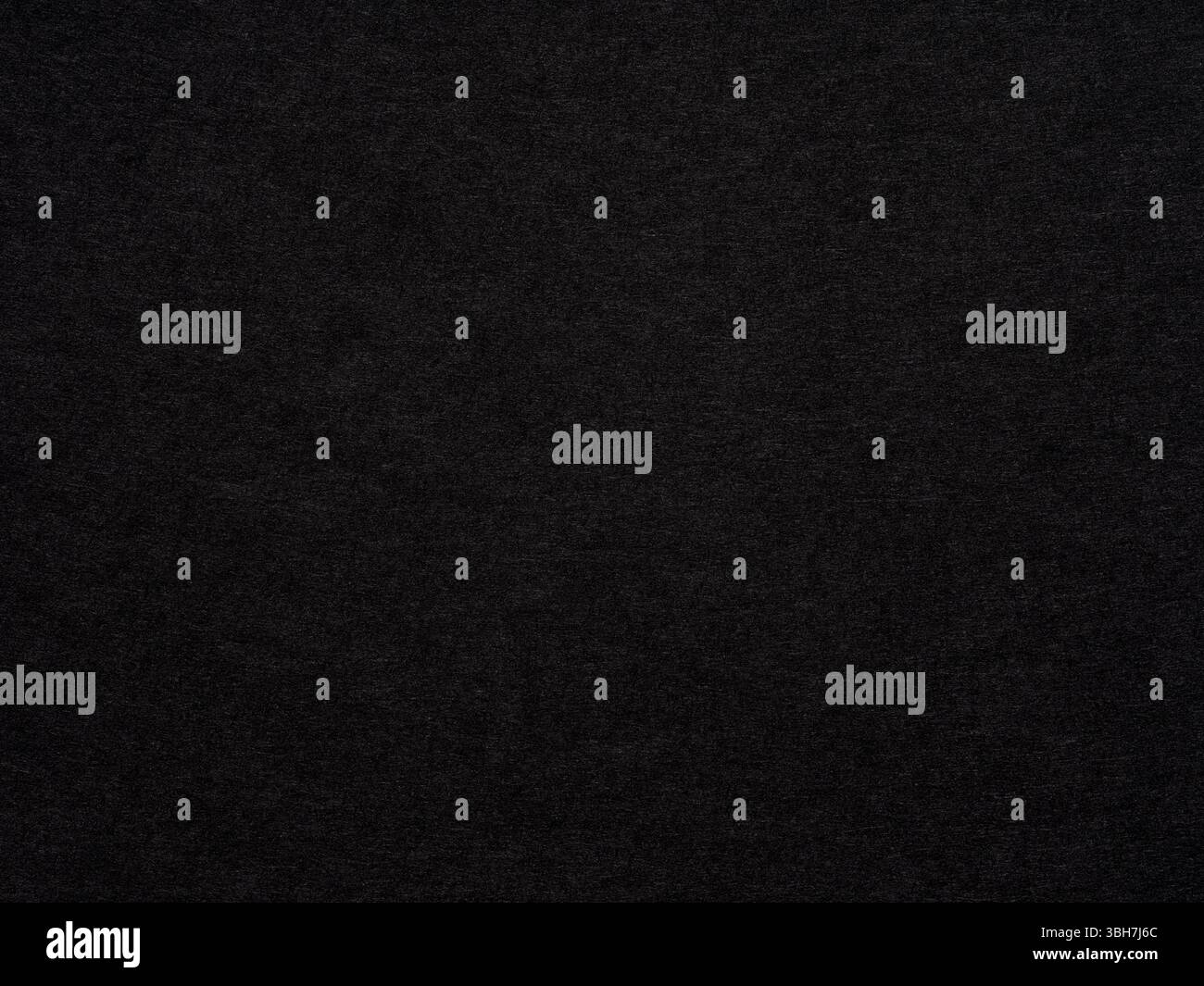 In the quietude of night, a black textured surface whispers of elegance and understated complexity Stock Photo