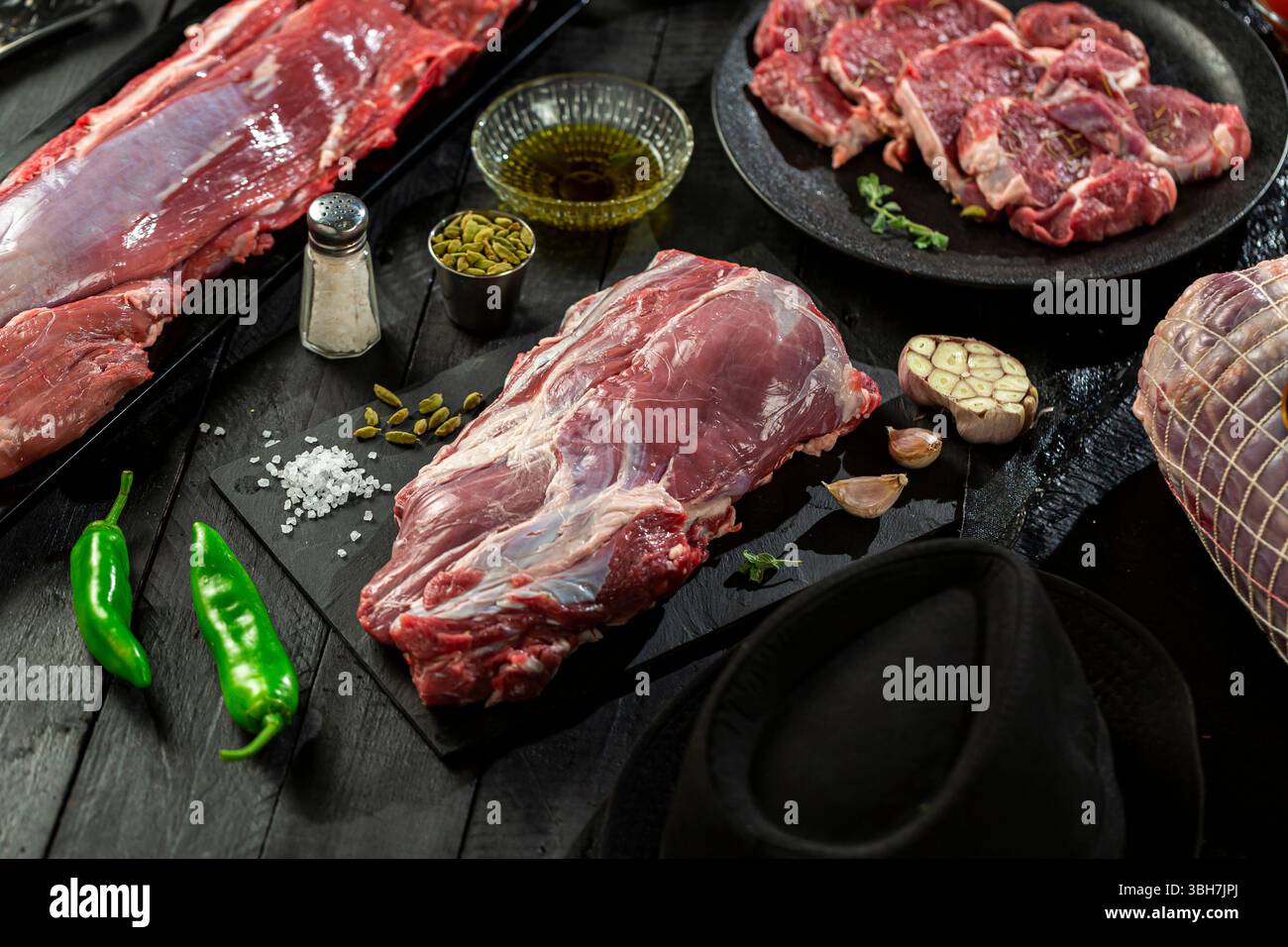 Large fresh raw veal chunk, black background. Stock Photo