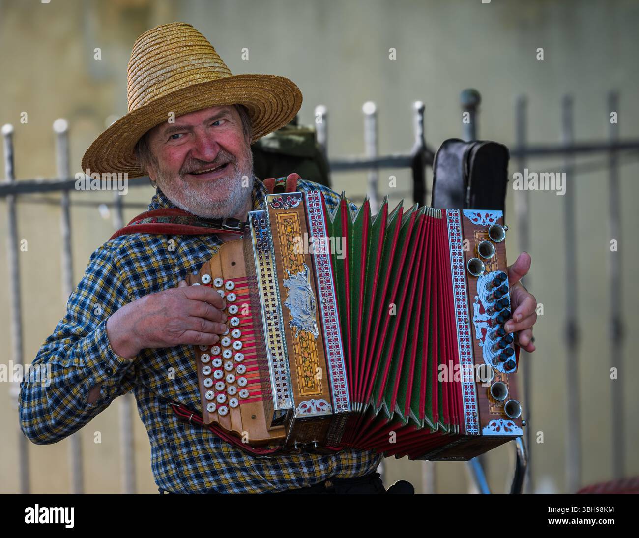 Padna Padna, Slovenia--April 28, 2025. Photo of a farmer playing a squeezebox ...