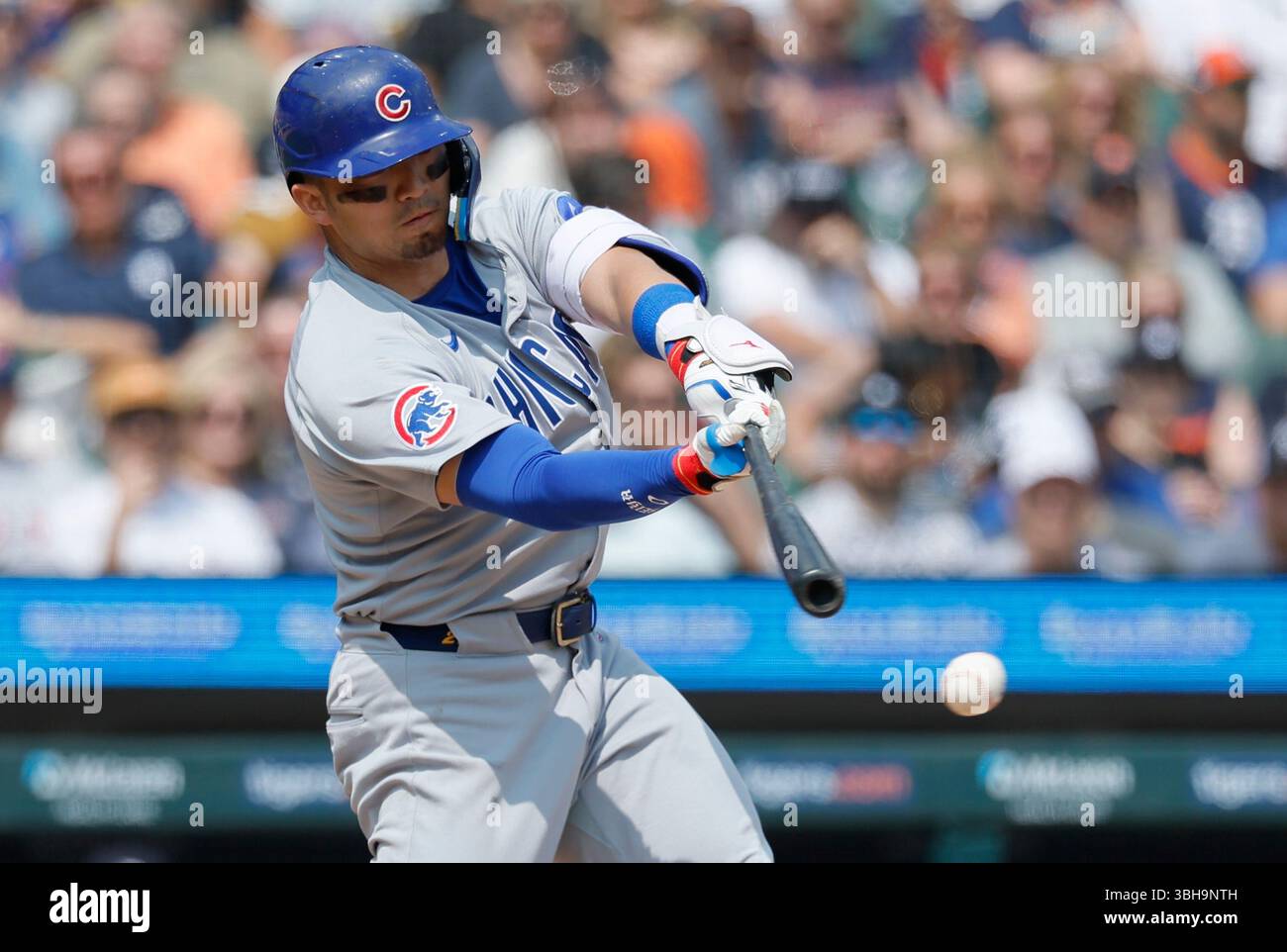 Chicago Cubs' Seiya Suzuki swings for a strike against the Detroit
