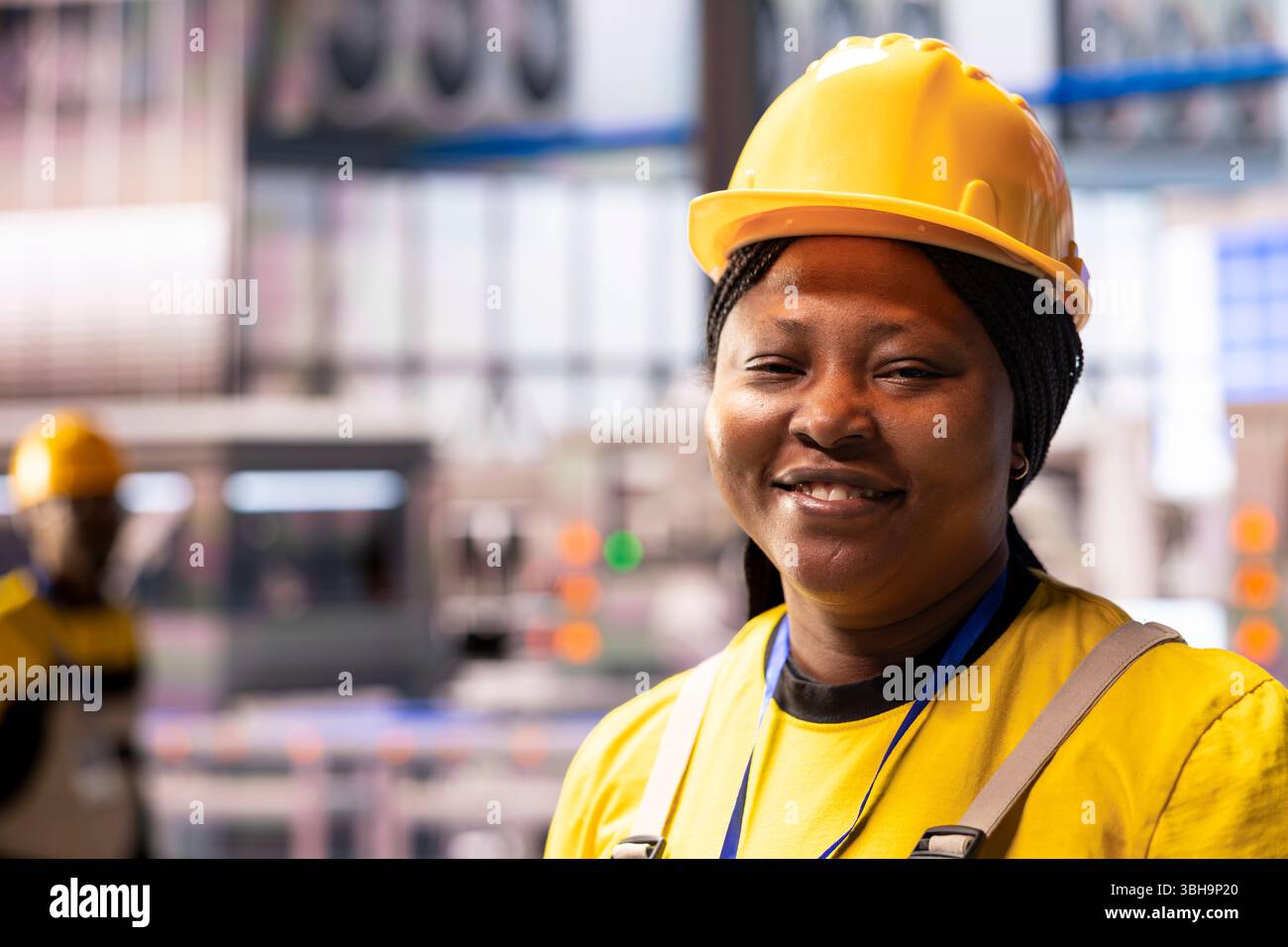 Professional engineer in smart factory optimizing industrial automation ...