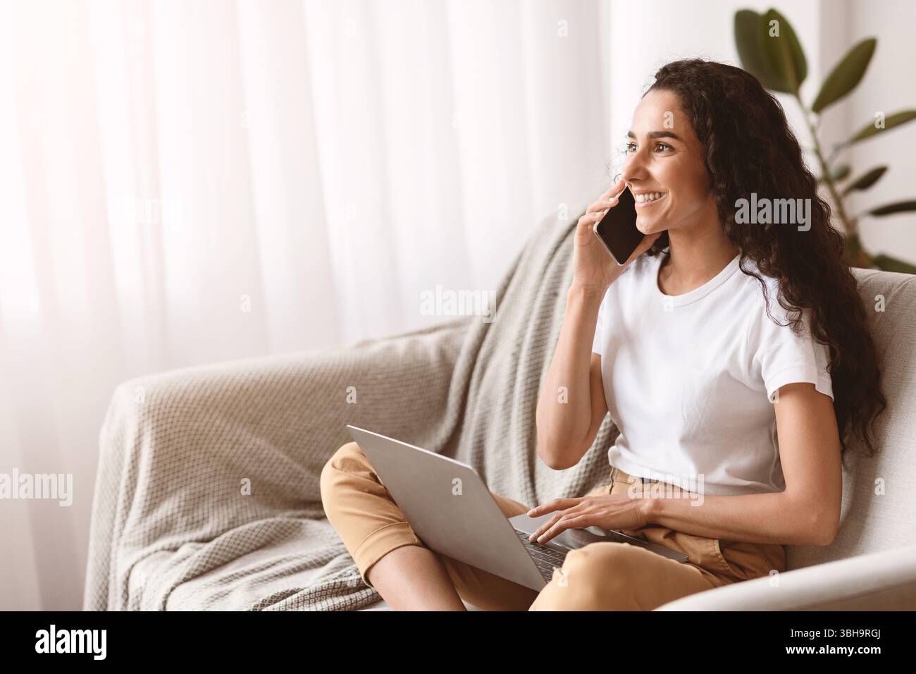 Beautiful brunette woman enjoying weekend at home Stock Photo