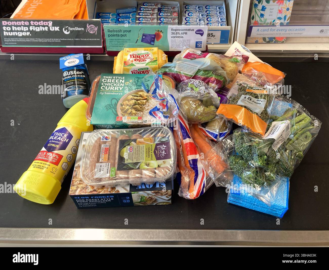 At Sainsbury's supermarket checkout with shopping, UK - Smartphone Captured Stock Image