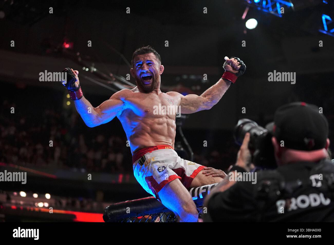 Georgia's Merab Dvalishvili, left, celebrates after winning. his ...