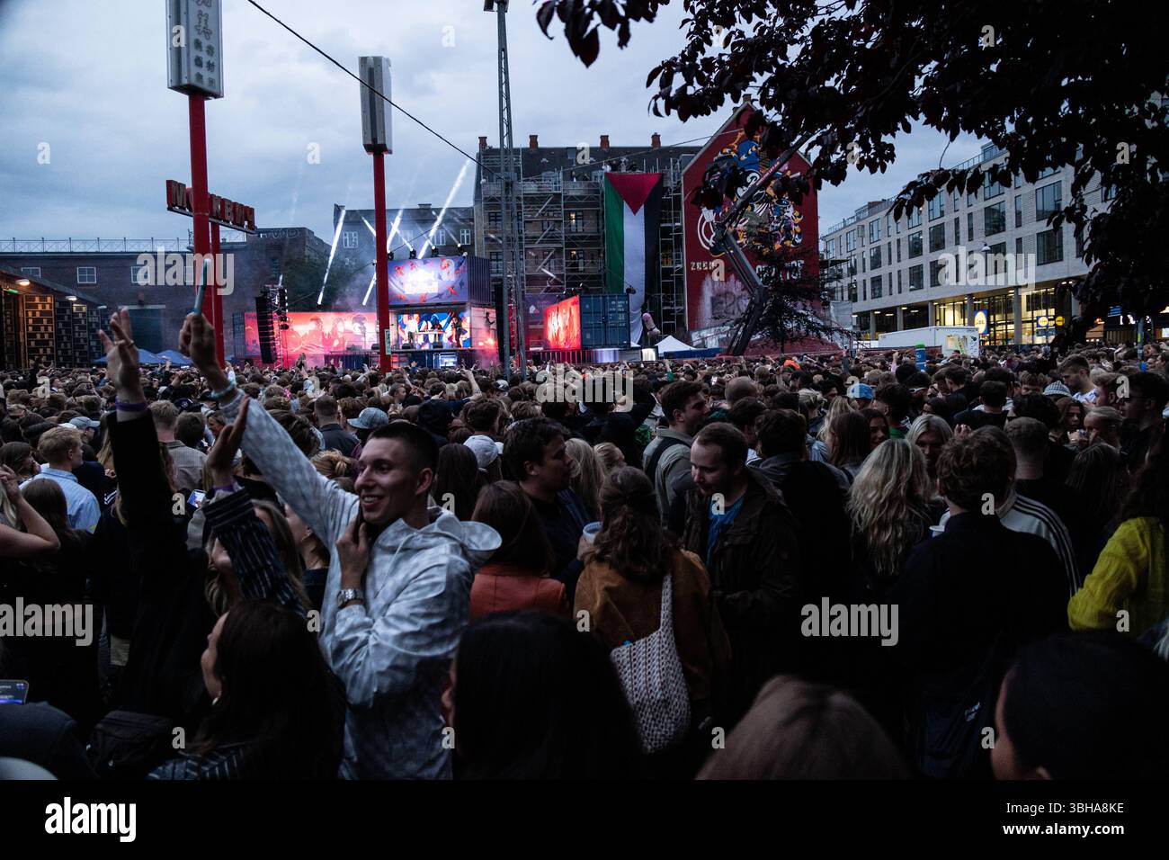 People gather at Den Rode Plads during Copenhagen Distortion 2025 in ...