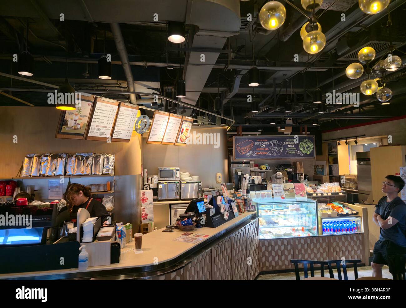 Pacific Coffee at the 1st floor walking level at the Great Eagle Centre in Wanchai, Hong Kong. - Smartphone Captured Stock Image