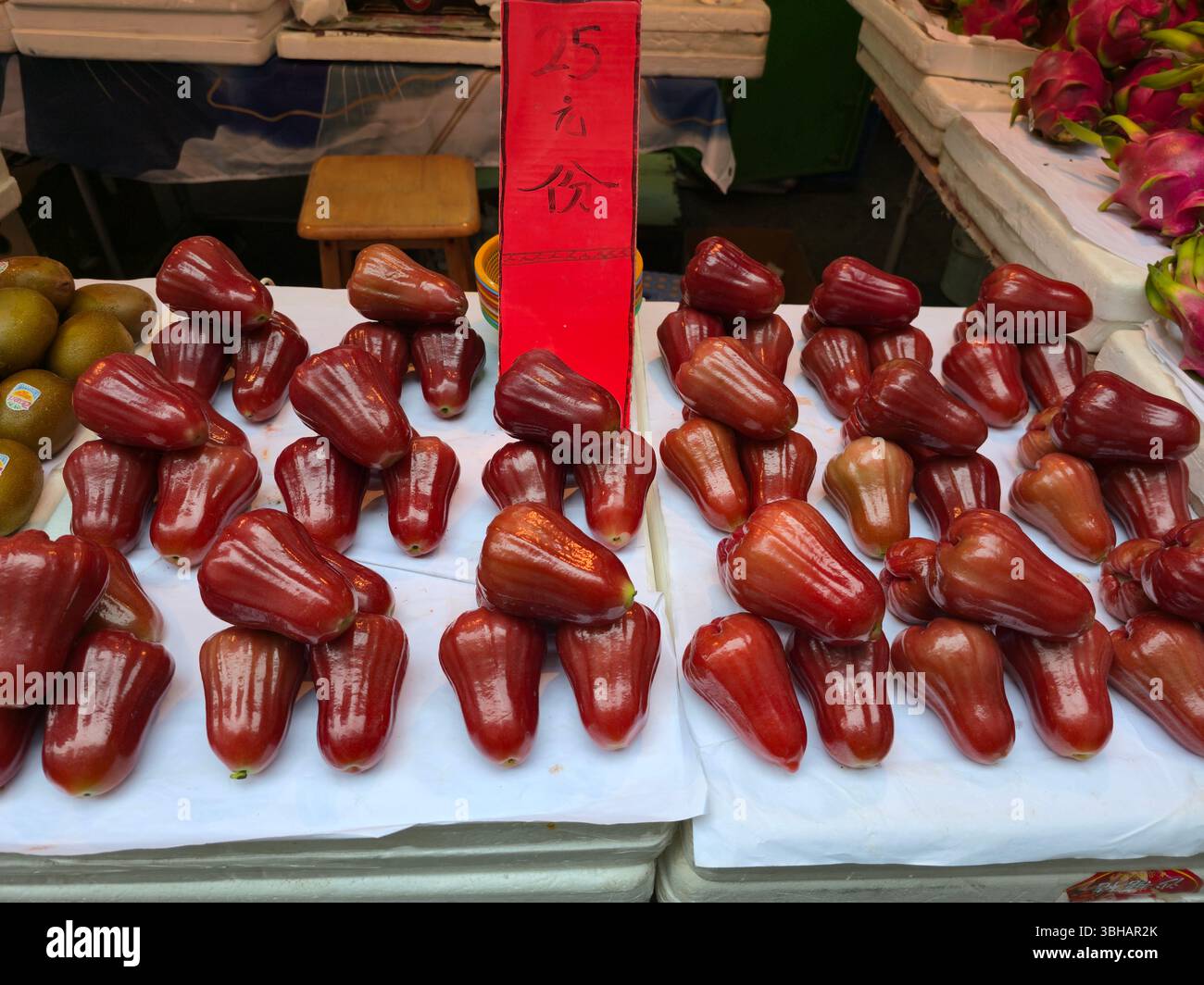 A stall selling Rose Apples in the market in Mong Kok, Kowloon, Hong Kong. - Smartphone Captured Stock Image