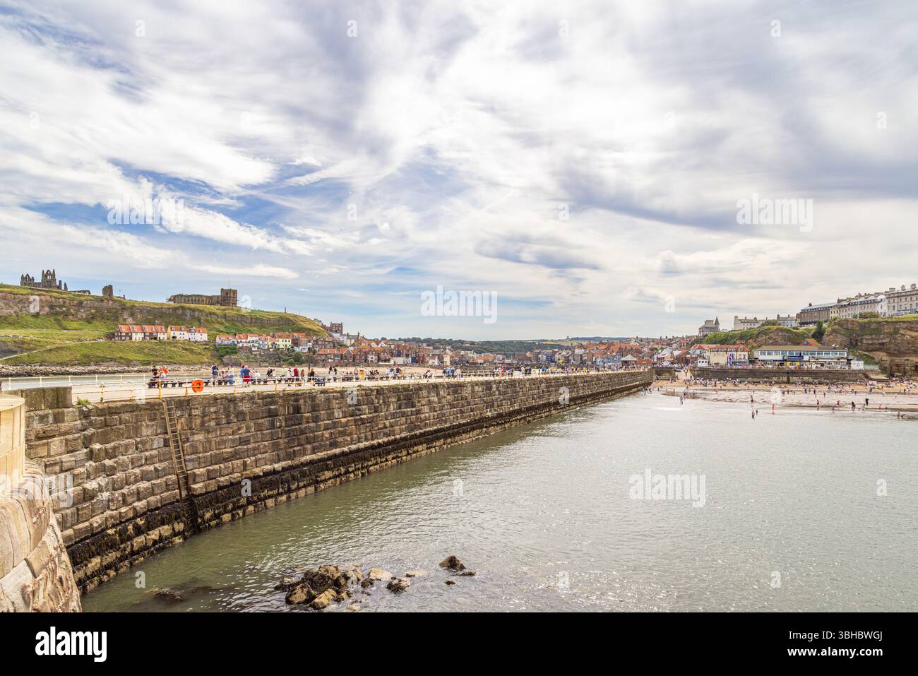 Looking back from Whitby West Pier towards the town, with the sea ...