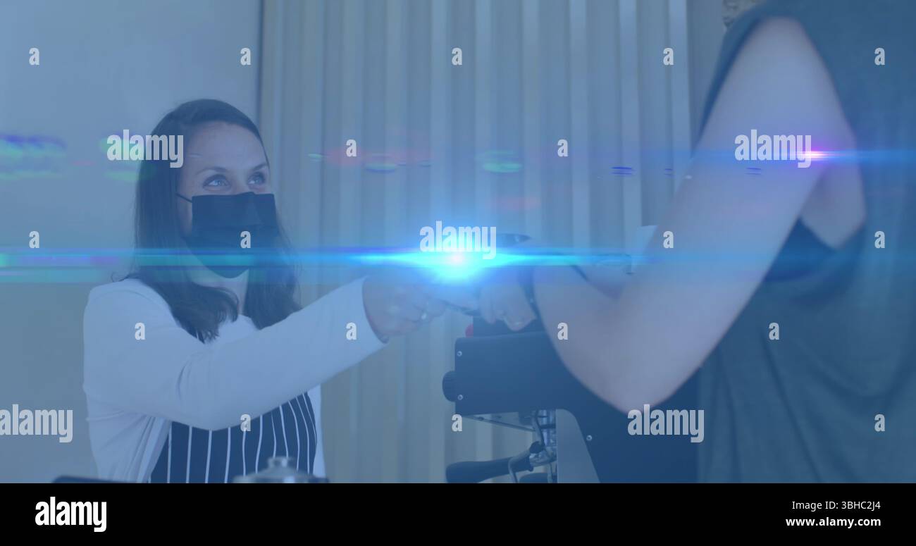 Composition of smiling businesswoman using smartphone in office with motion blur. Global business connections data processing and technology concept d Stock Photo