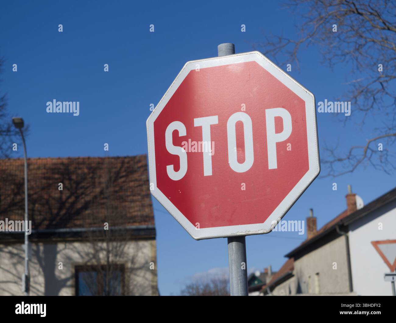 Stop Sign At Intersection Stock Photo - Alamy