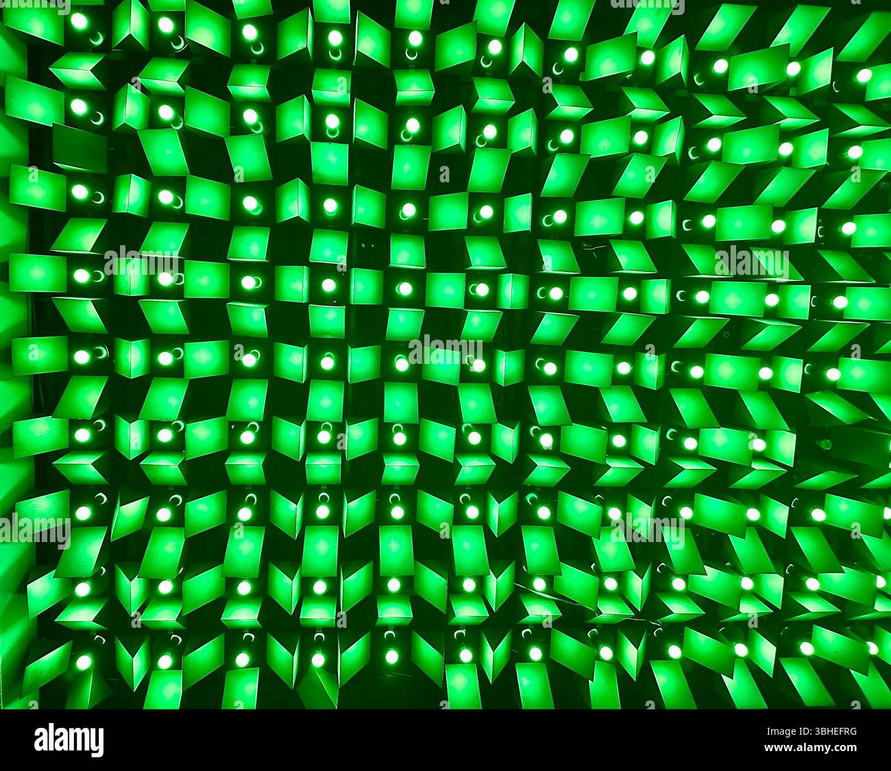 Glowing green light ceiling at New Century Hall, Manchester, UK — abstract architectural detail ideal for backgrounds or design use - Smartphone Captured Stock Image