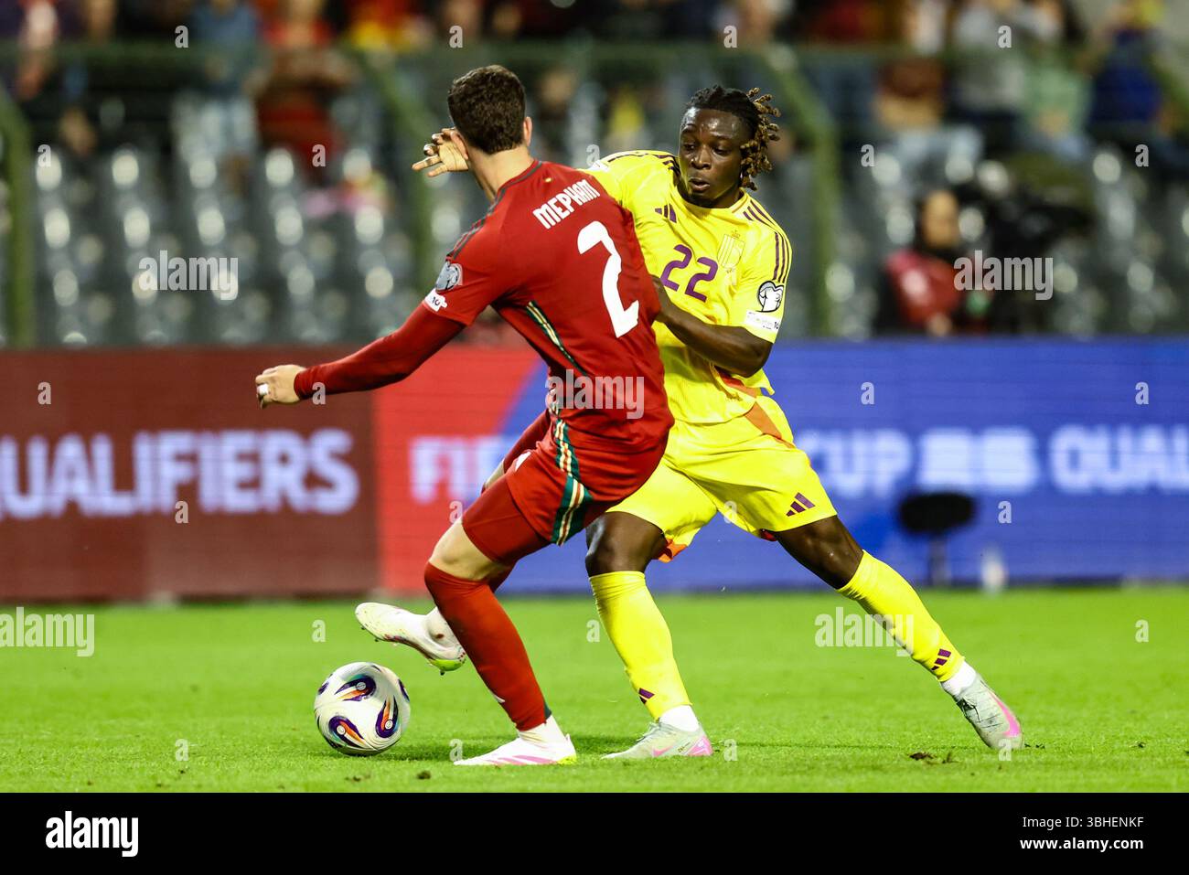 Empha M Wales' Chris Mepham (left) and Belgium's Jeremy Doku battle for the ...