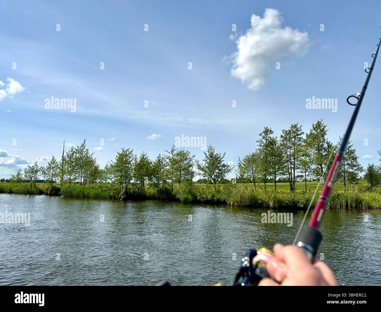 Fishing in the river Peene, Mecklenburg-Vorpommern, Germany - Smartphone Captured Stock Image
