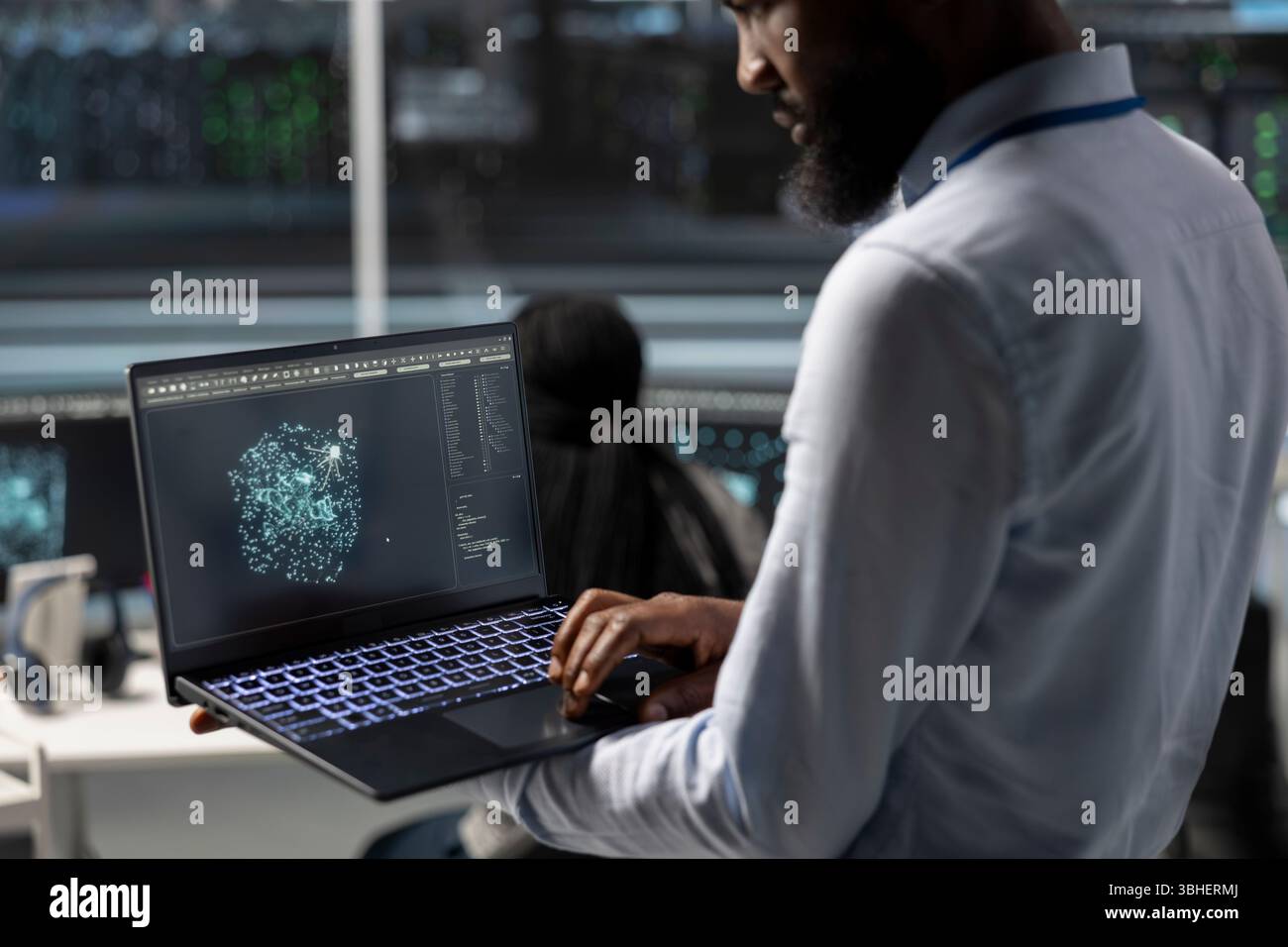 Data center engineer uses AI visualization tool on laptop to optimize resource allocation. Server hub IT expert uses artificial intelligence analysis on notebook to do maintenance Stock Photo