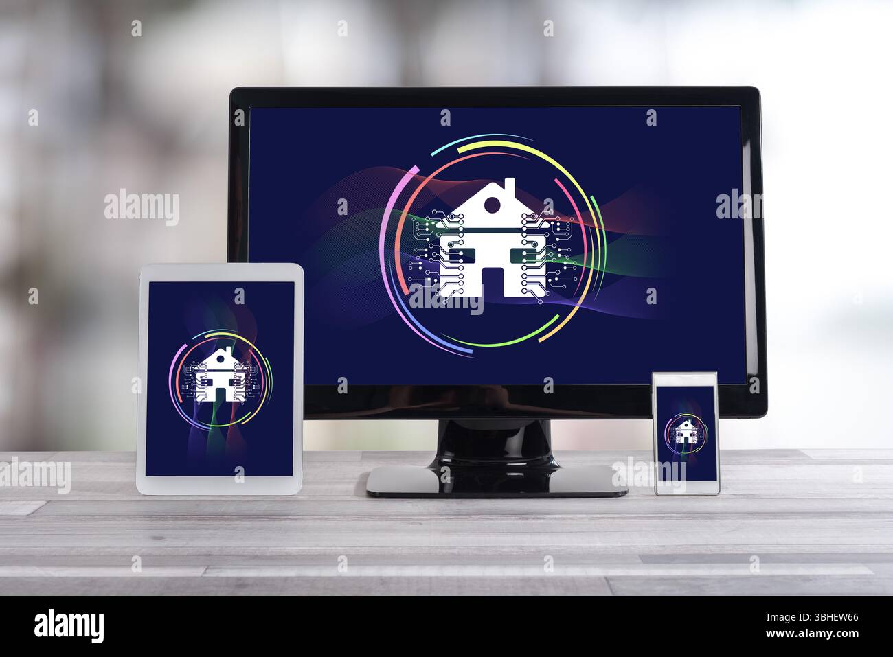 Smart home concept shown on different information technology devices Stock Photo