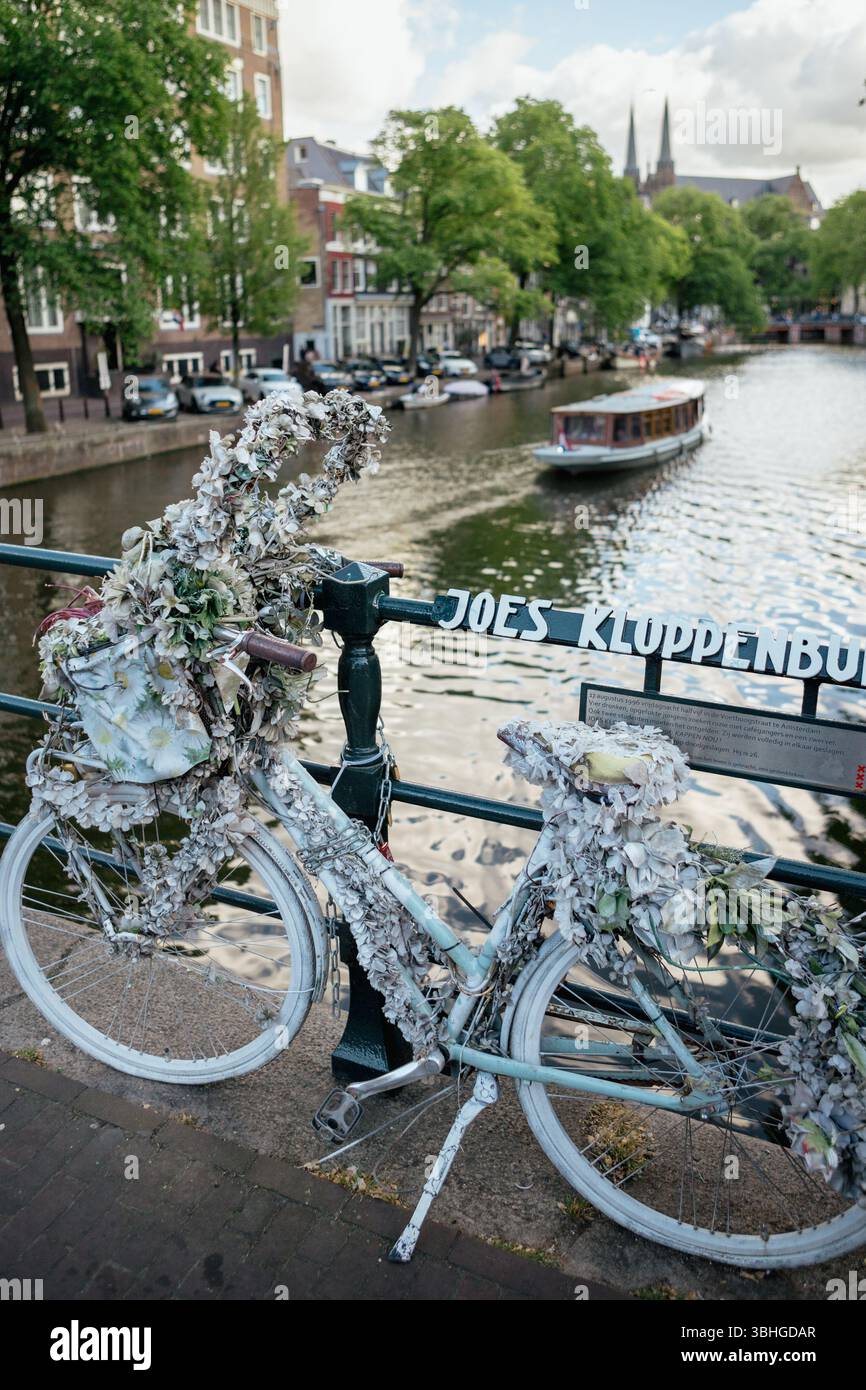 Bicycle Art Over the Canals of Historic Negen Straatjes in Amsterdam Stock Photo