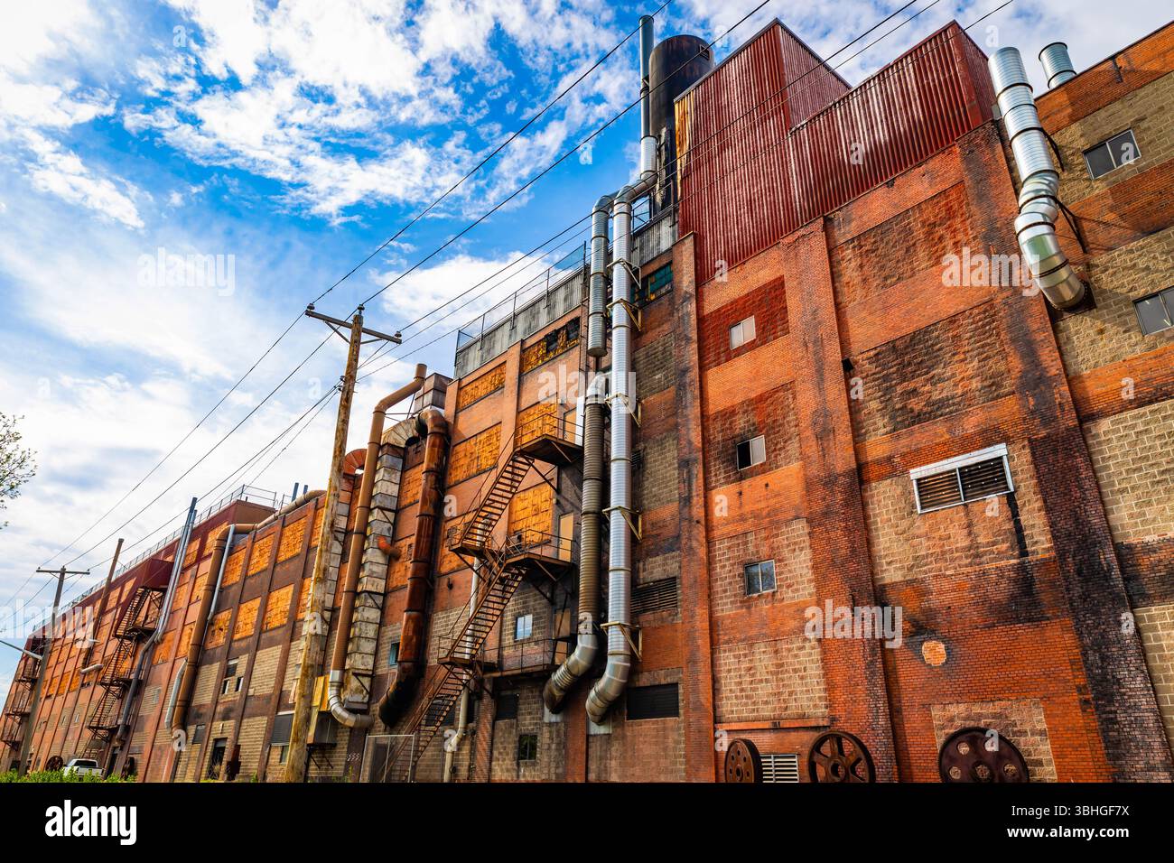 Raw Building Eau Claire, WI, USA - 05-14-2025: Brick industrial building featuring ...