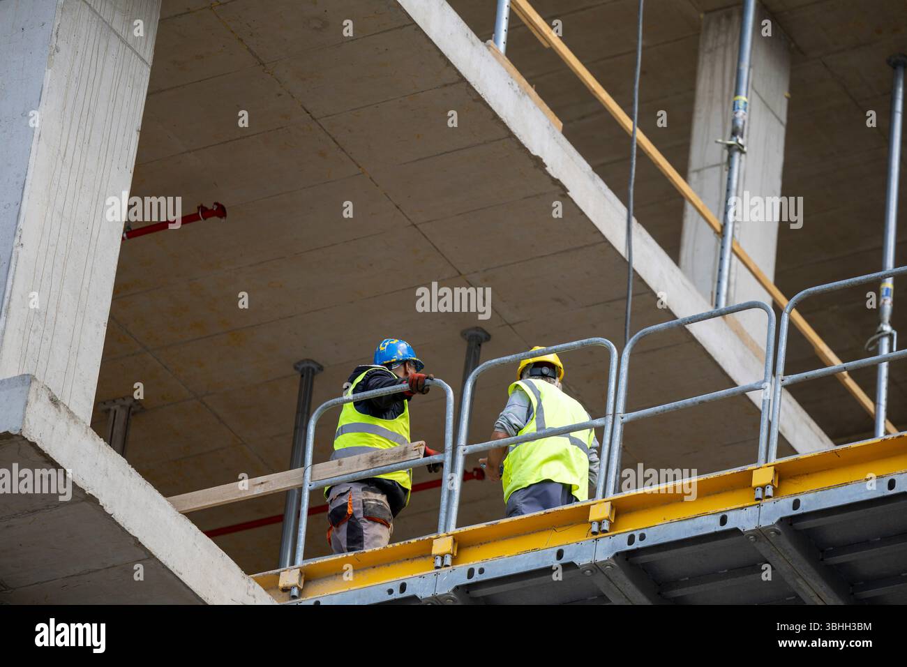 2 Worker Task Two construction workers engage in hi-res stock photography and images ...