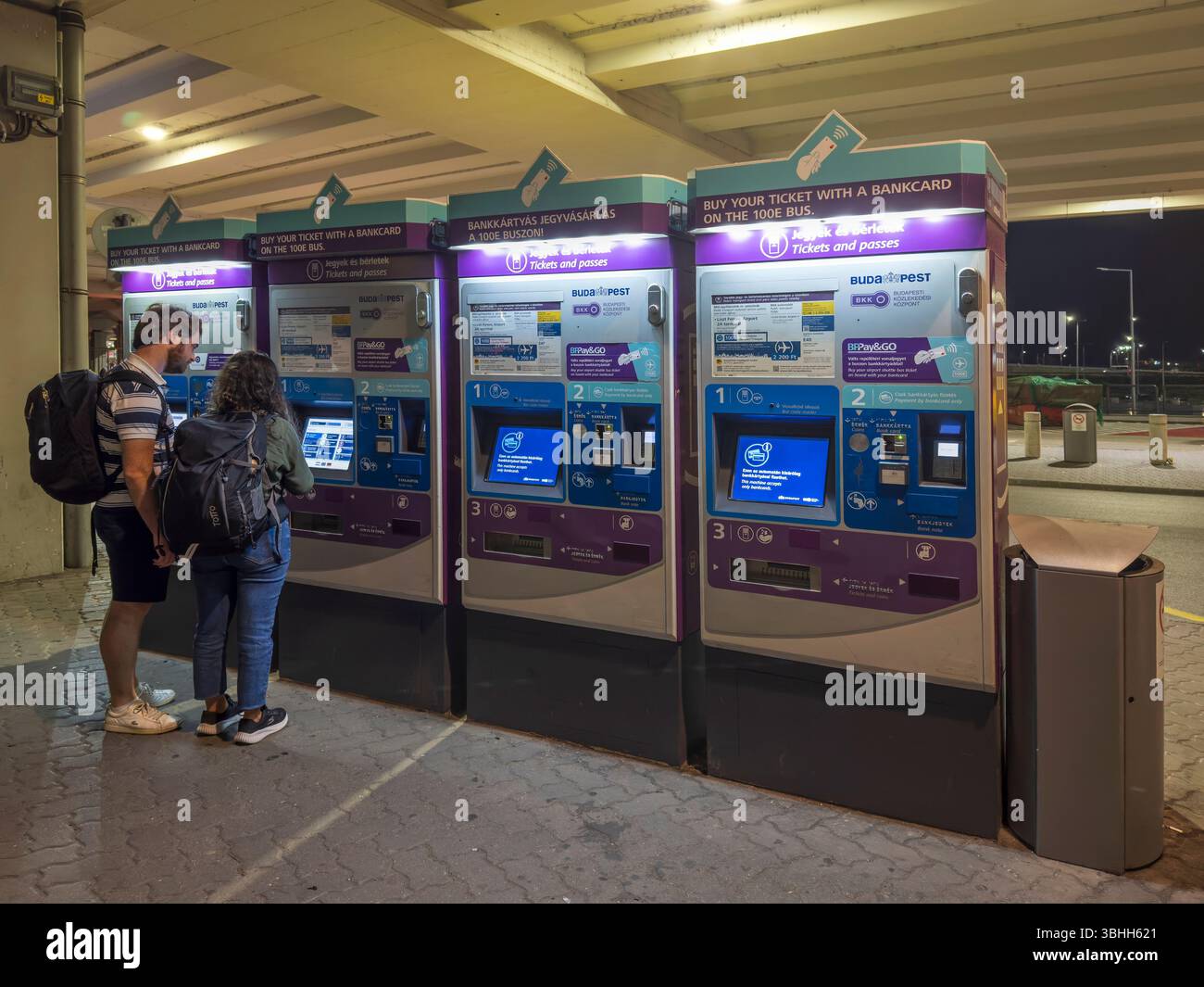 Terminal Customers customers using public transport self service ticket machine outside of ...