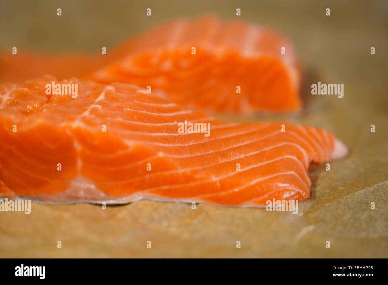 Fresh Raw Salmon Fillets on Parchment Paper Stock Photo - Alamy
