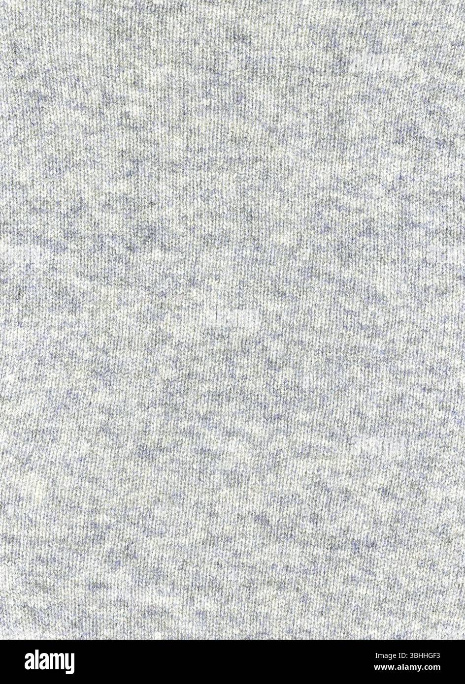Light grey coloured fine yarn knitted wool jumper texture background Stock Photo