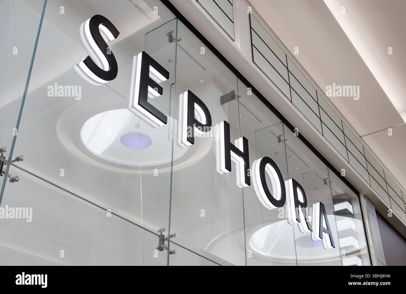 Close-up of the Sephora storefront signage on a glass facade in a ...