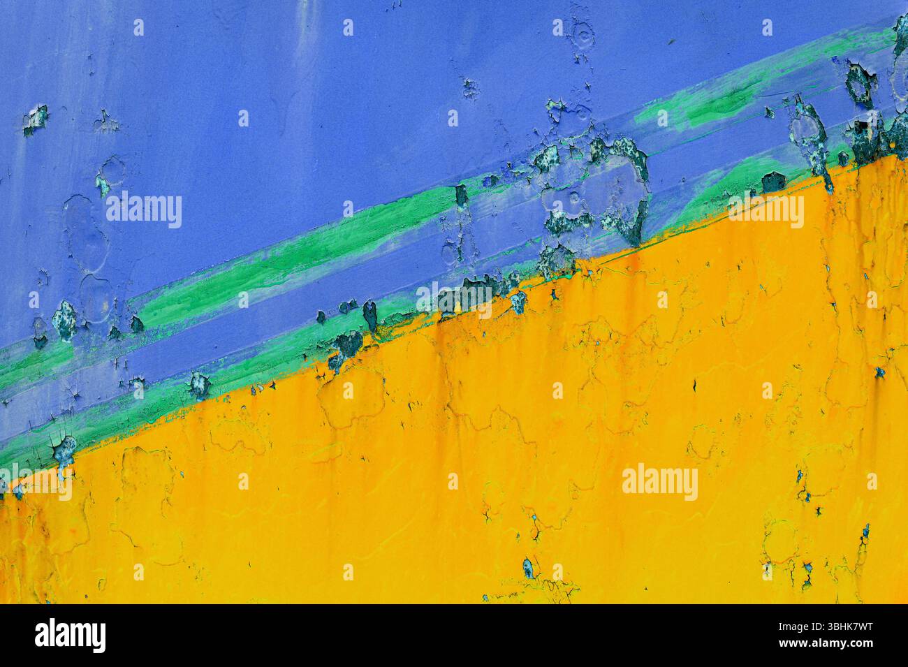 Yellow and blue painted grunge background creating an abstract and colorful texture Stock Photo