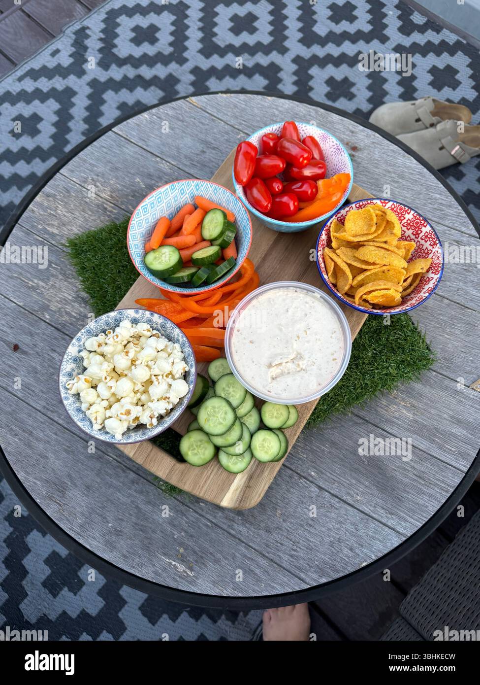 colorful veggie tray set up outside - Smartphone Captured Stock Image
