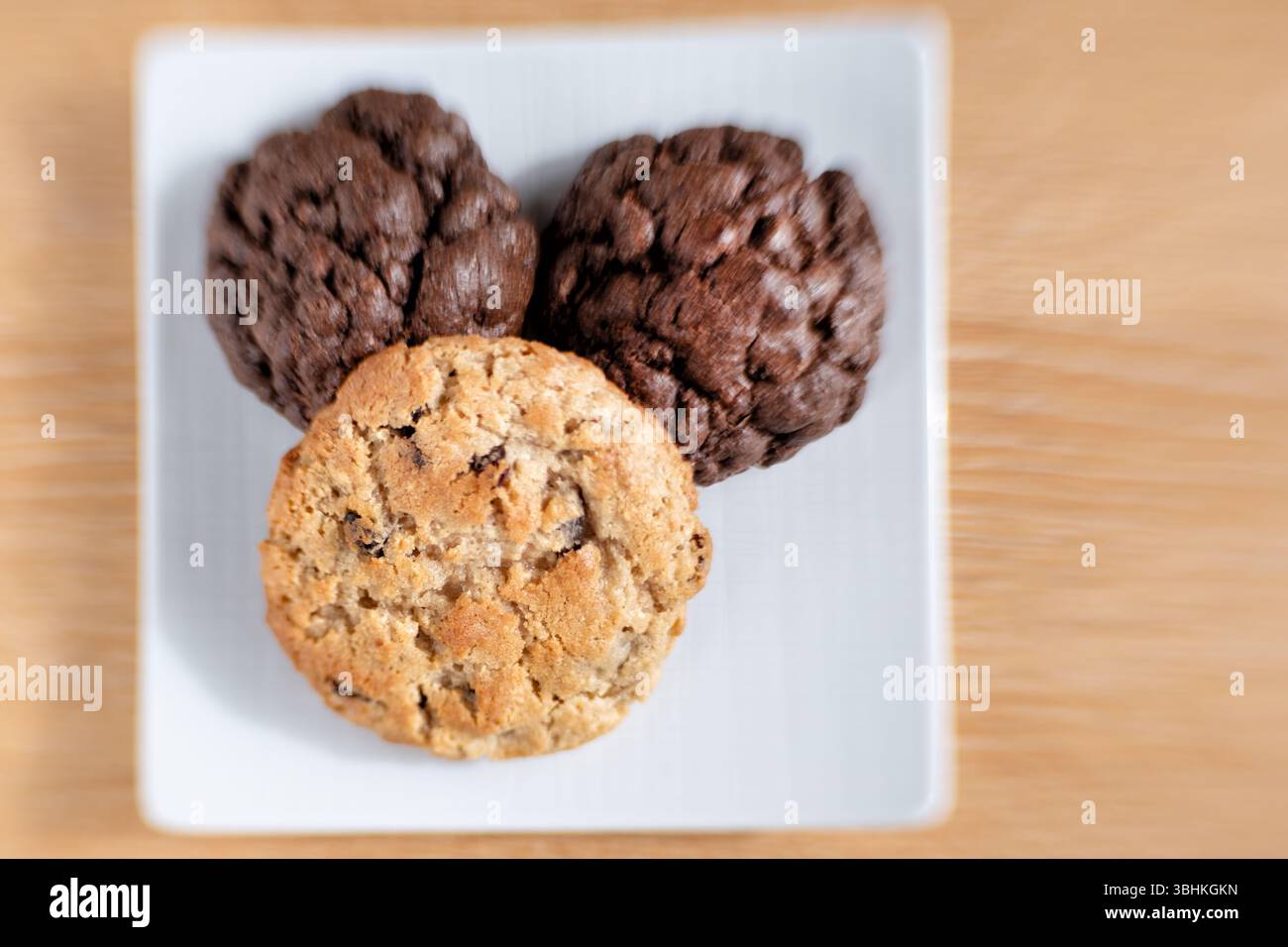 UK. Homemade New York style oat and raisin Cookies. They are large cookies with a  crisp outer crust and soft centre. Stock Photo