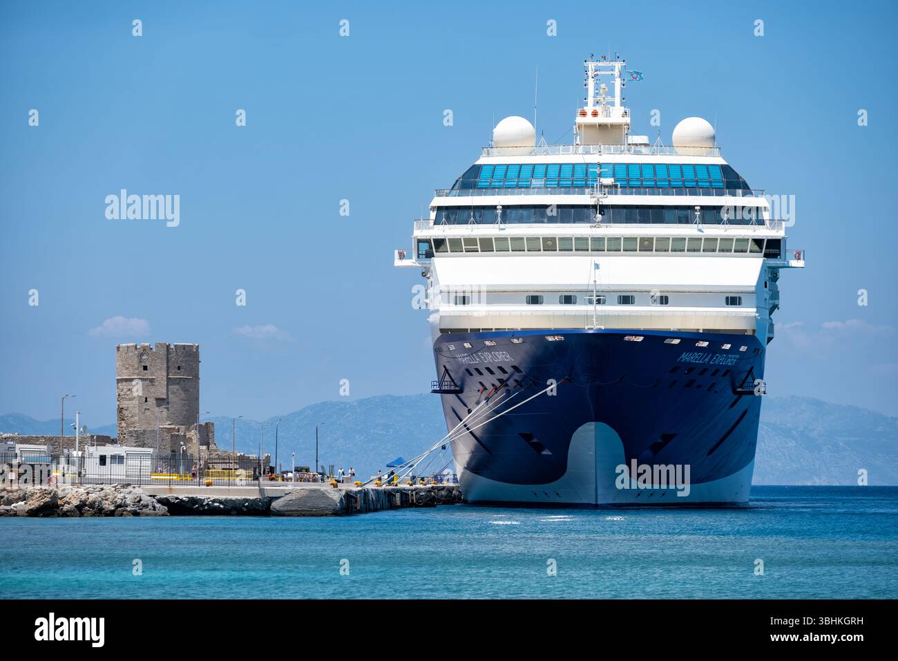 Rhodes, Greece. The TUI Marella Explorer cruise ship moored close to the beach in the cruise terminal of the port in Rhodes City Stock Photo