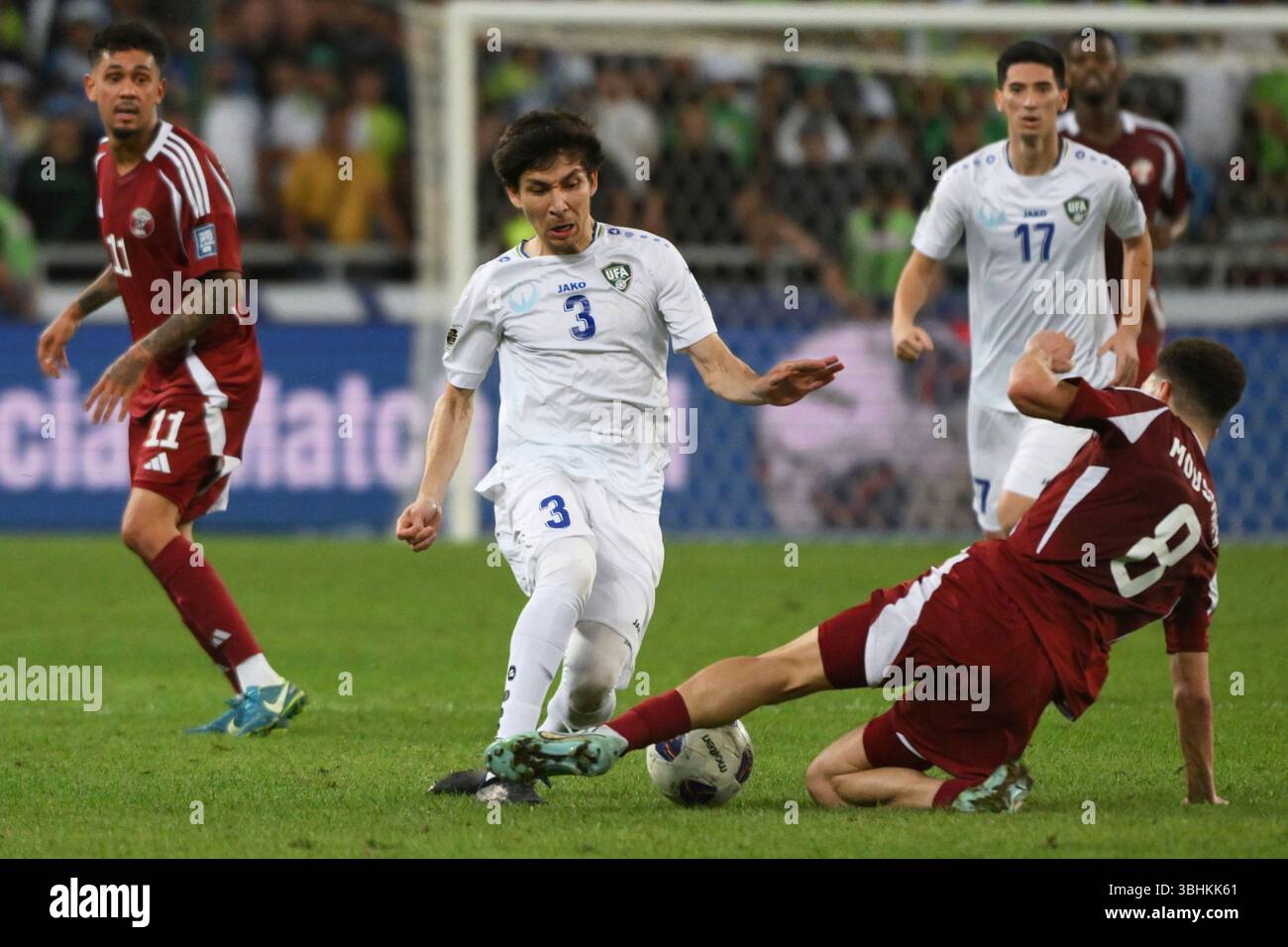 Uzbekistan S Khojiakbar Alijonov Centre Fights For The Ball With Uzbekistans Khojiakbar Alijonov Centre Fights For The Ball With Qatars Moustafa Tarek During A World Cup 2026 Qualifying Soccer Match Between Uzbekistan And Qatar At The Milliy Stadium In Tashkent Uzbekistan Tuesday June 10 2025 Ap Photo 3BHKK61 