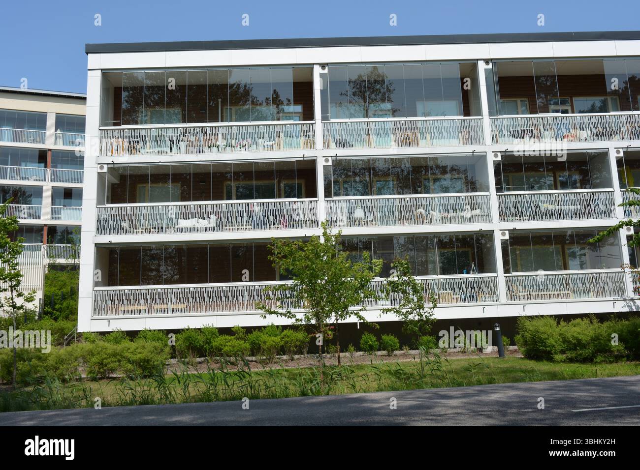 Picture of The sun in Espoo city, Finland. New beautiful white houses with large ...