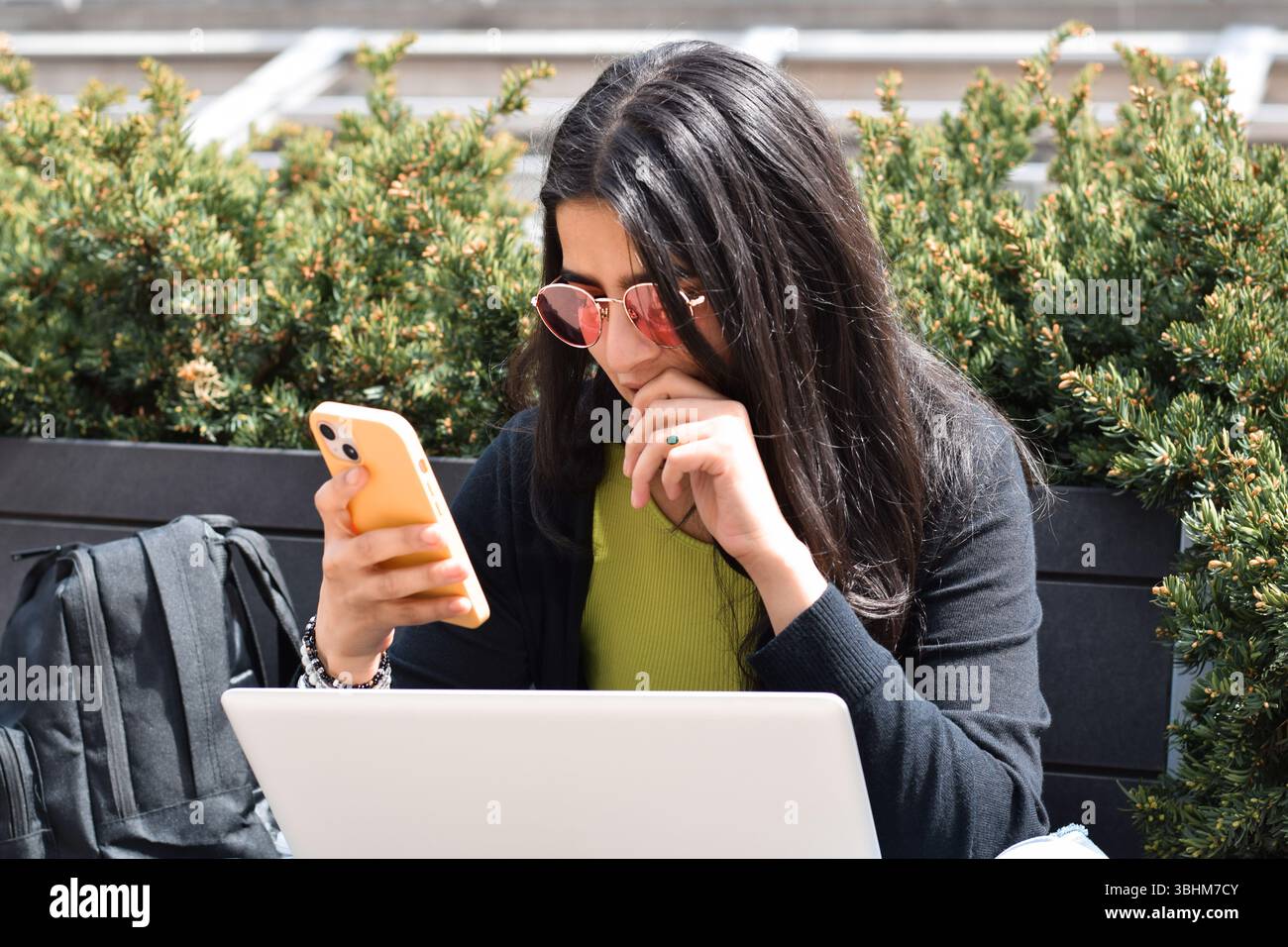 Woman using phone on street hi-res stock photography and images - Alamy