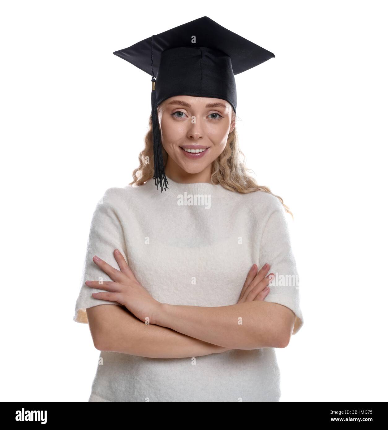 Happy student with crossed arms after graduation on white background ...