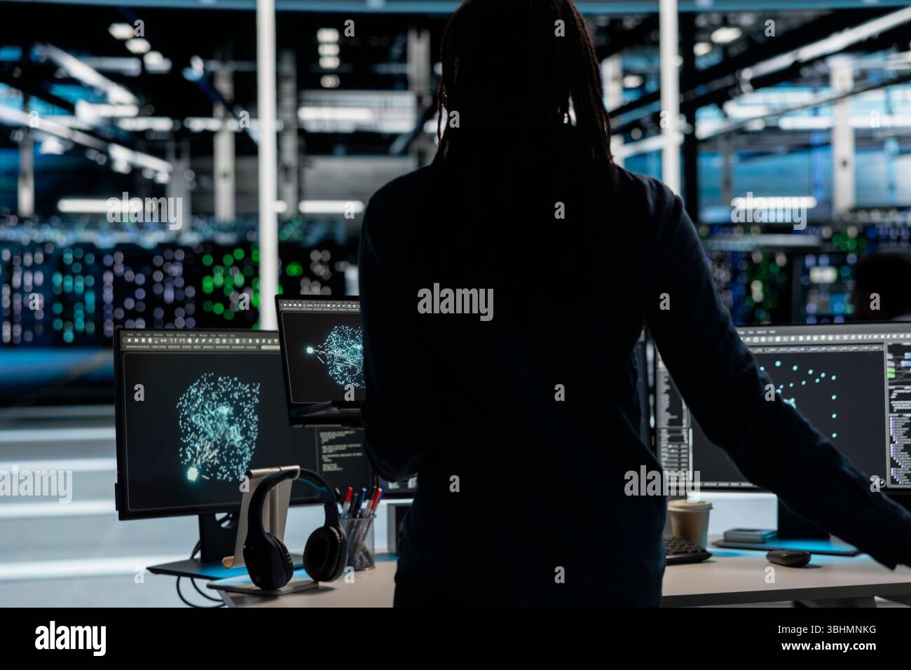 Data center engineer uses AI visualization tool on laptop to oversee automated repetitive tasks. Worker adapting server systems based on data analytics graphs using notebook device Stock Photo