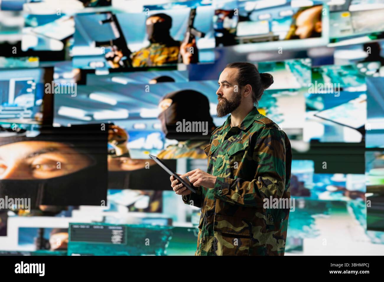 Military personnel monitoring drone and satellite imagery to gather ...