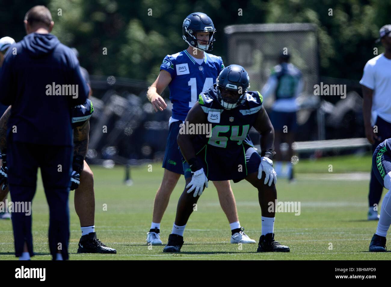 Seattle Seahawks quarterback Sam Darnold (14) lines up behind guard ...