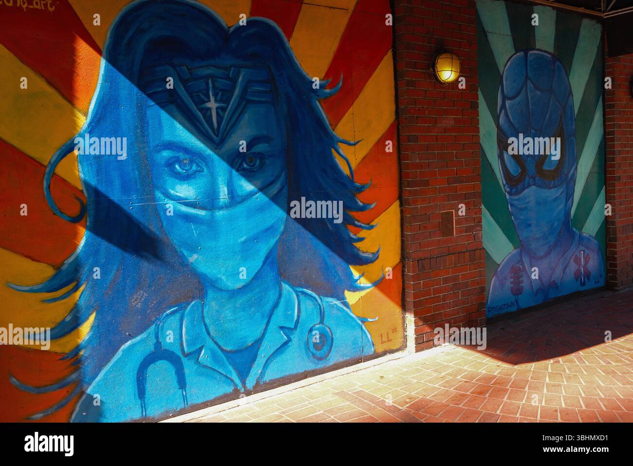 A Wonder Woman & Spider-Man mural along Water Street in Gastown during the Covid 19 pandemic, Vancouver, BC. Stock Photo