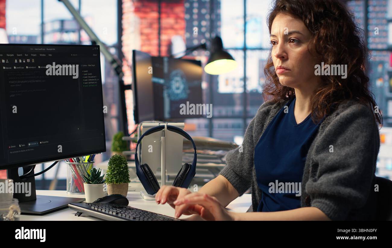 Admin writing code and doing maintenance on artificial intelligence neural networks computerized model. Woman tech support expert doing checkup on AI systems, data science. Camera B. Stock Photo