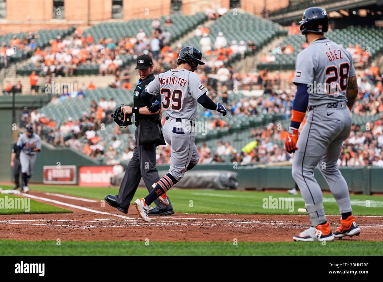 Detroit Tigers' Zach McKinstry (39) scores on a sacrifice fly hit in by