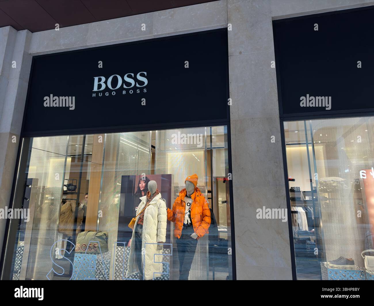 Geneva, Switzerland - Jan 12, 2023: Hugo Boss store. Hugo Boss is a German luxury fashion house. - Smartphone Captured Stock Image