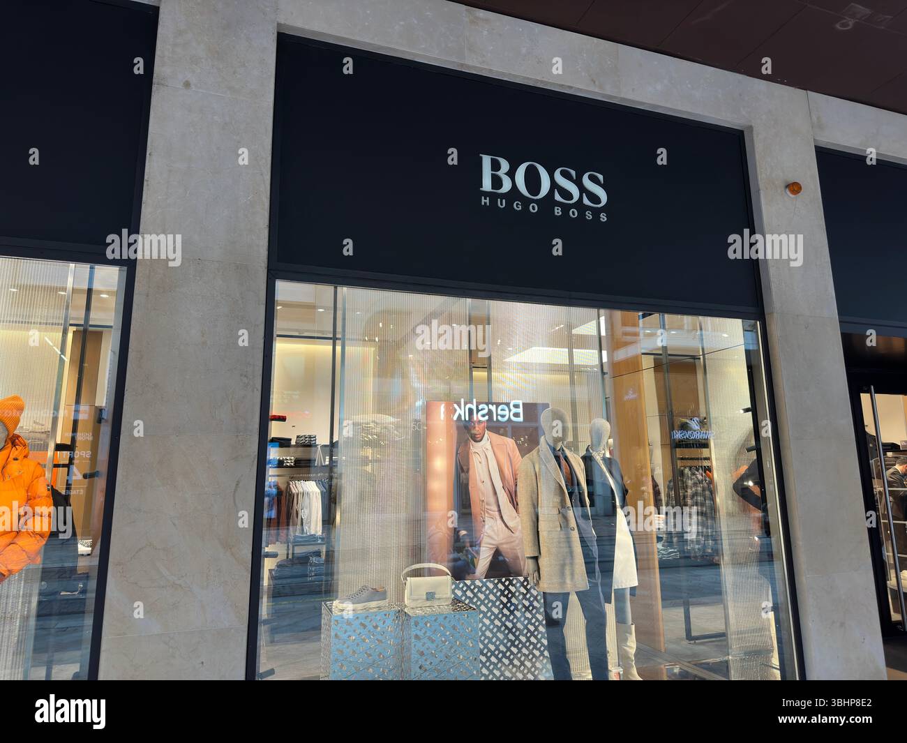 Geneva, Switzerland - Jan 12, 2023: Hugo Boss store. Hugo Boss is a German luxury fashion house. - Smartphone Captured Stock Image