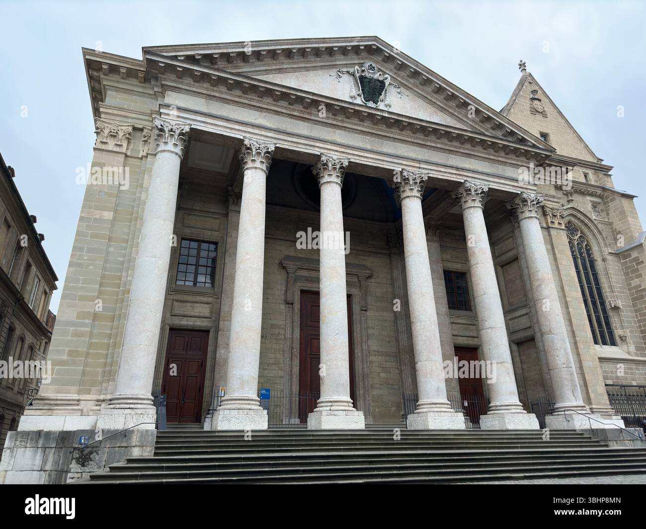 Geneva Cathedral showcases impressive architecture with towering columns and a historical facade. - Smartphone Captured Stock Image