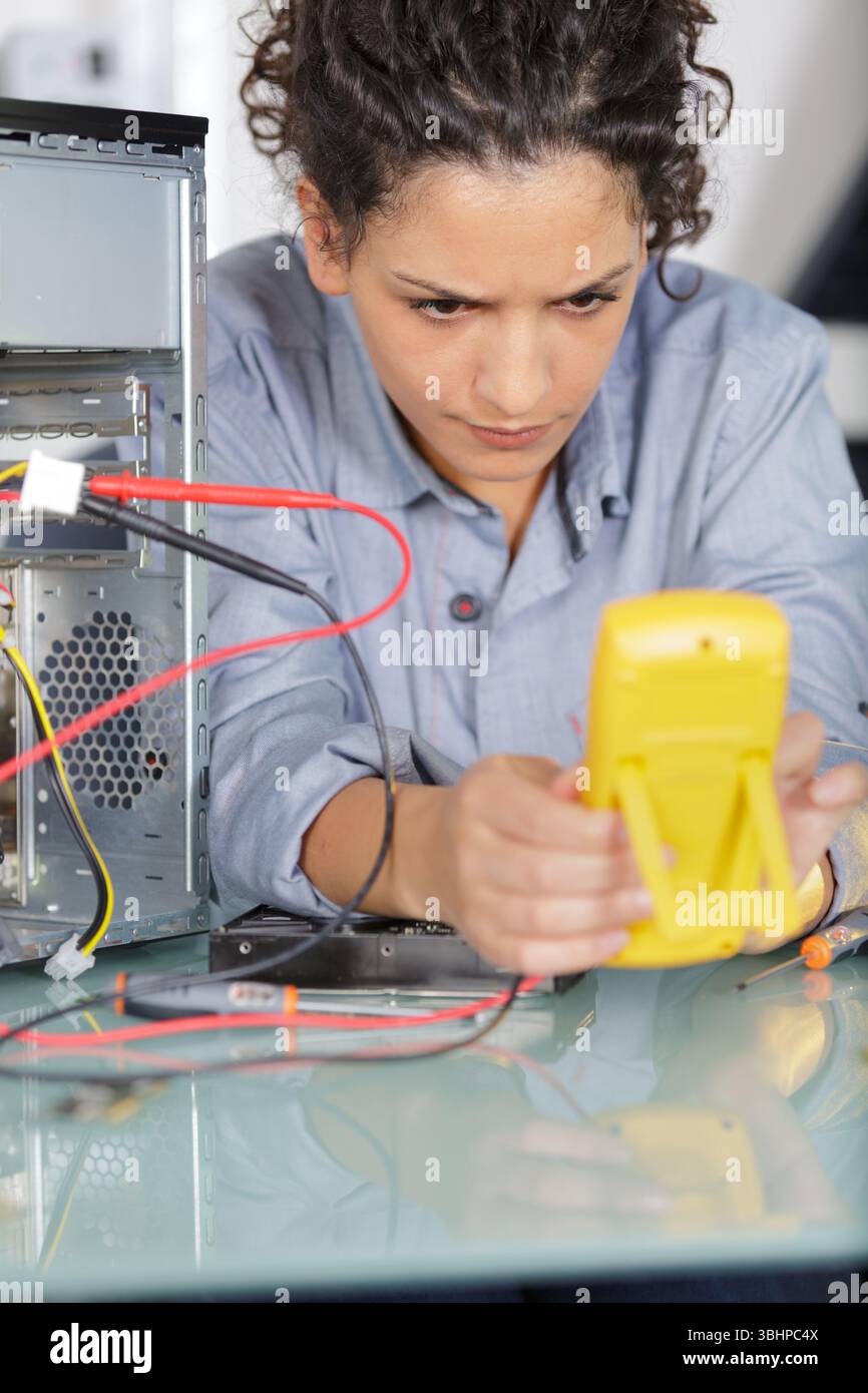 a woman during computer repair Stock Photo