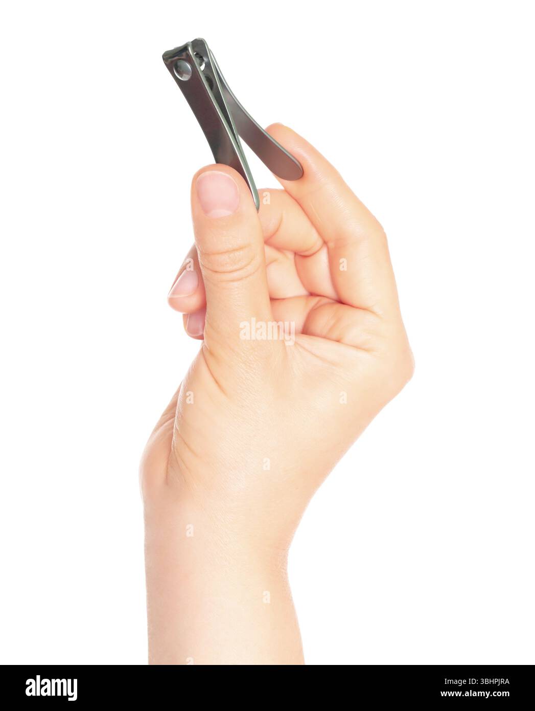 Woman hand holds manicure nail clipper, isolated on a transparent background, cosmetic tools concept Stock Photo