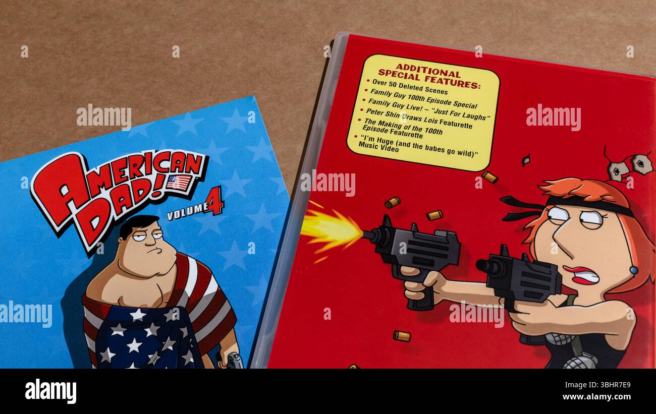 DVD box of Family Guy with an American Dad flyer, isolated on a blank background. Stock Photo