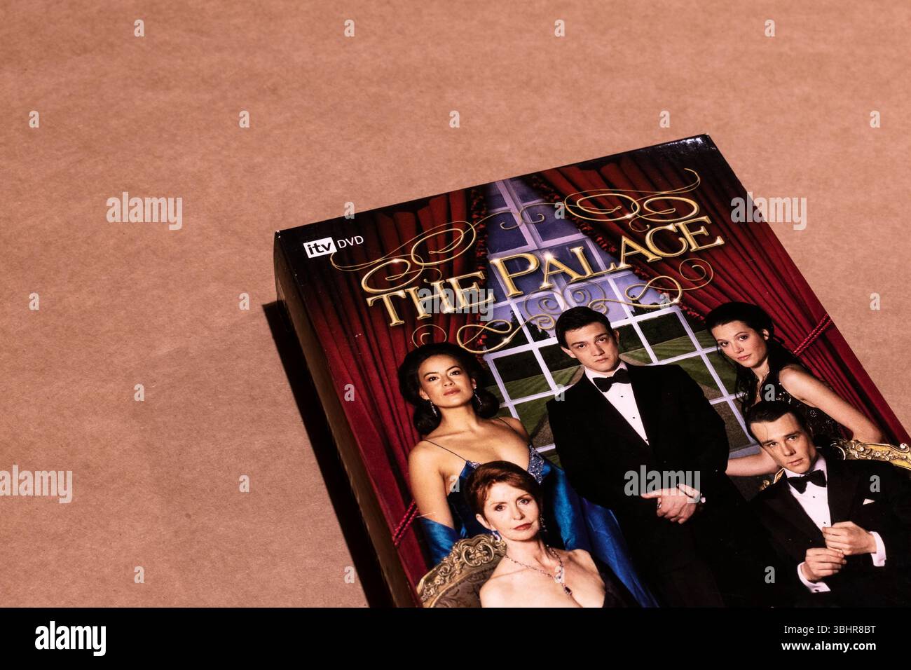 A DVD box of The Palace series featuring the main characters on its cover, isolated on a blank background Stock Photo